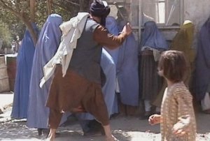 Taliban_beating_woman_in_public_RAWA.jpg