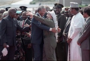 477499-mandela-is-embraced-by-plo-leader-arafat-as-he-arrives-at-lusaka-airport.jpg