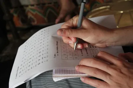 Kelsey practices writing the Tifinagh alphabet.jpg