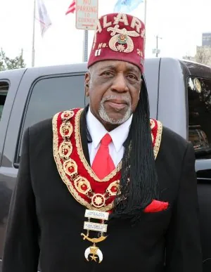 Shriner-in-distinctive-red-fez-and-regalia.jpg
