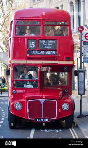 a-red-double-decker-routemaster-bus-front-view-full-of-passangers-C2DJJY.jpg
