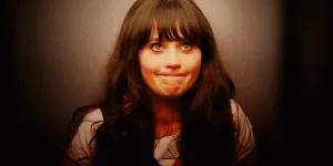 80200-zooey-deschanel-shy-lips-gif-Slru.gif